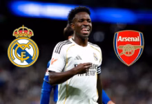 Vinicius Junior smiling while wearing the Real Madrid shirt.