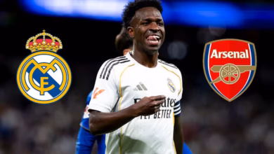 Vinicius Junior smiling while wearing the Real Madrid shirt.