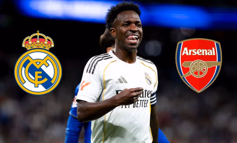 Vinicius Junior smiling while wearing the Real Madrid shirt.