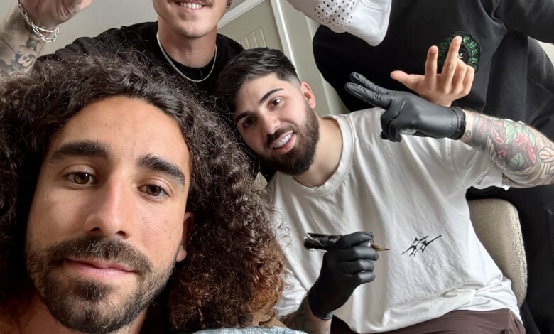 Marc Cucurella showing his Luis de la Fuente World Cup tattoo.