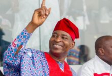 Bernard Antwi-Bosiako (Wontumi), dressed in traditional red and blue attire